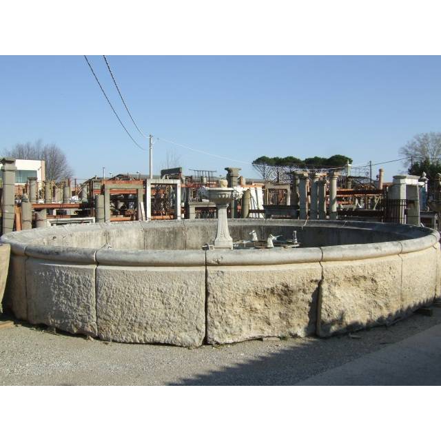 Large centerpiece fountain in reclaimed stone