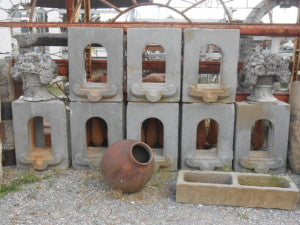 Ancient vat openings in salvaged sandstone