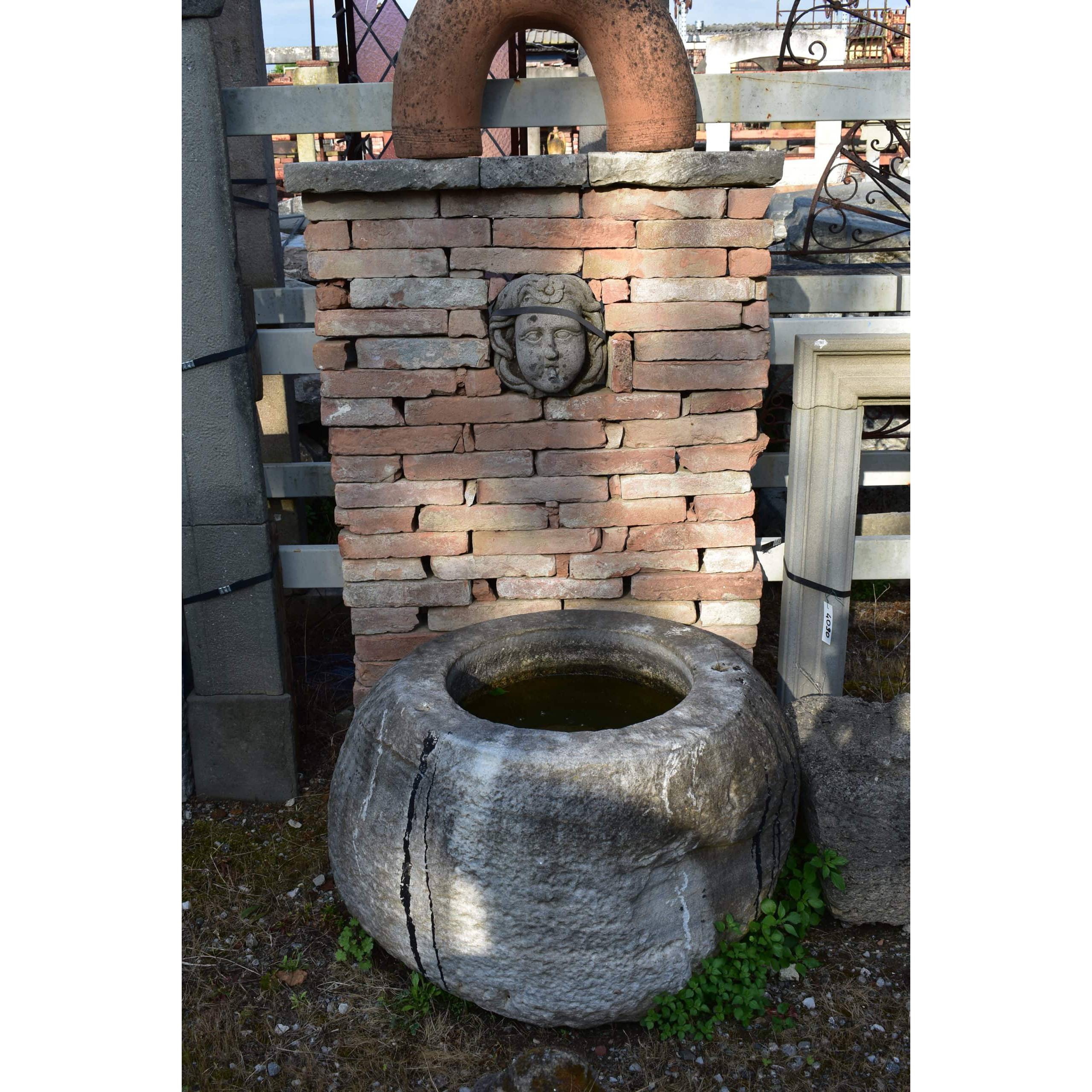 Reclaimed stone wall fountain