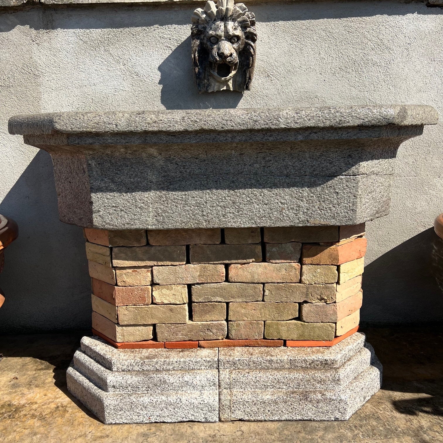 Granite wall-mounted bathtub