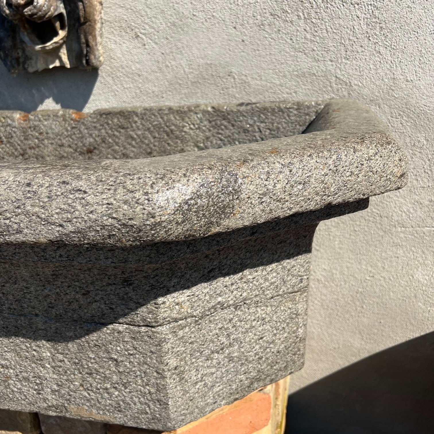 Granite wall-mounted bathtub