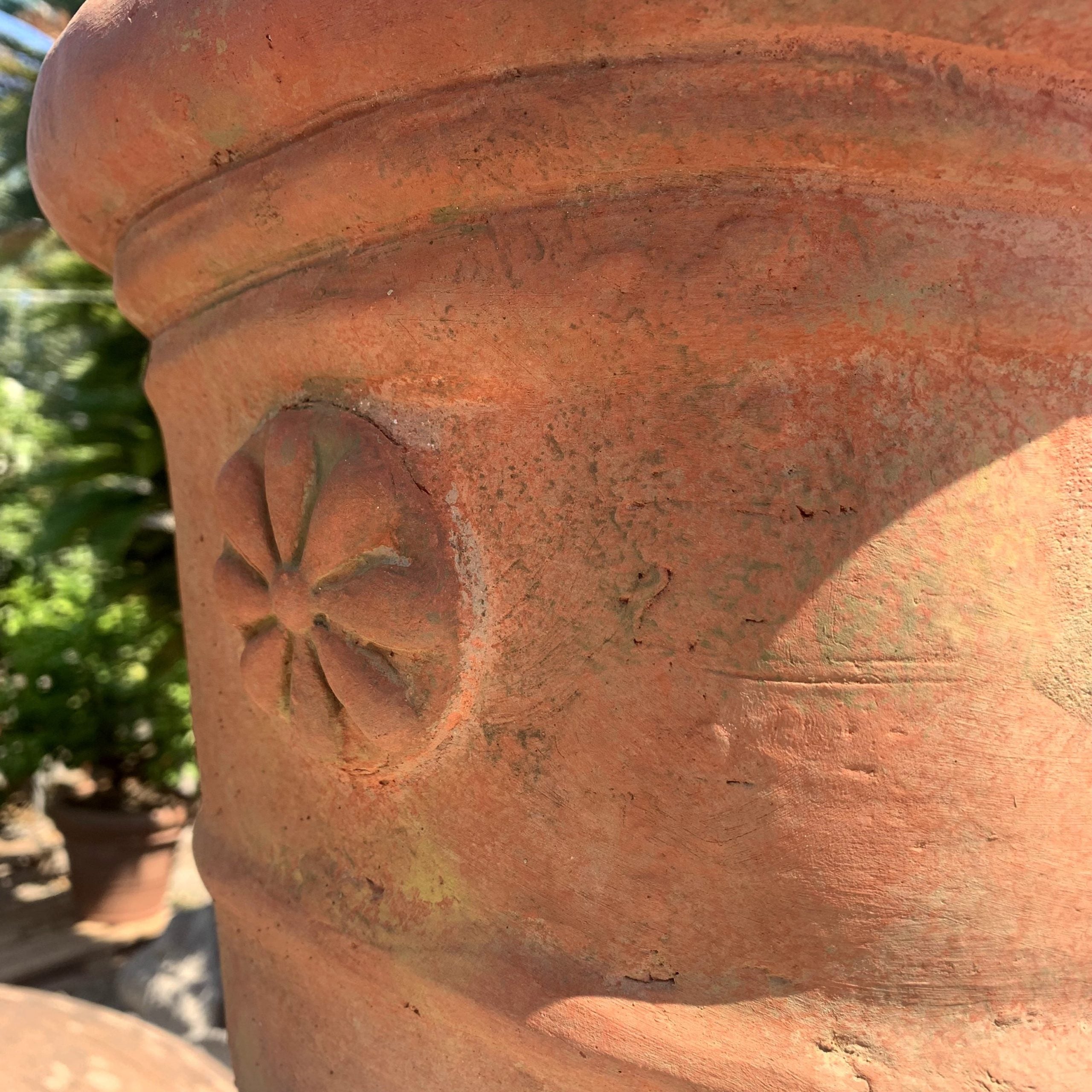 Terracotta vase with mask