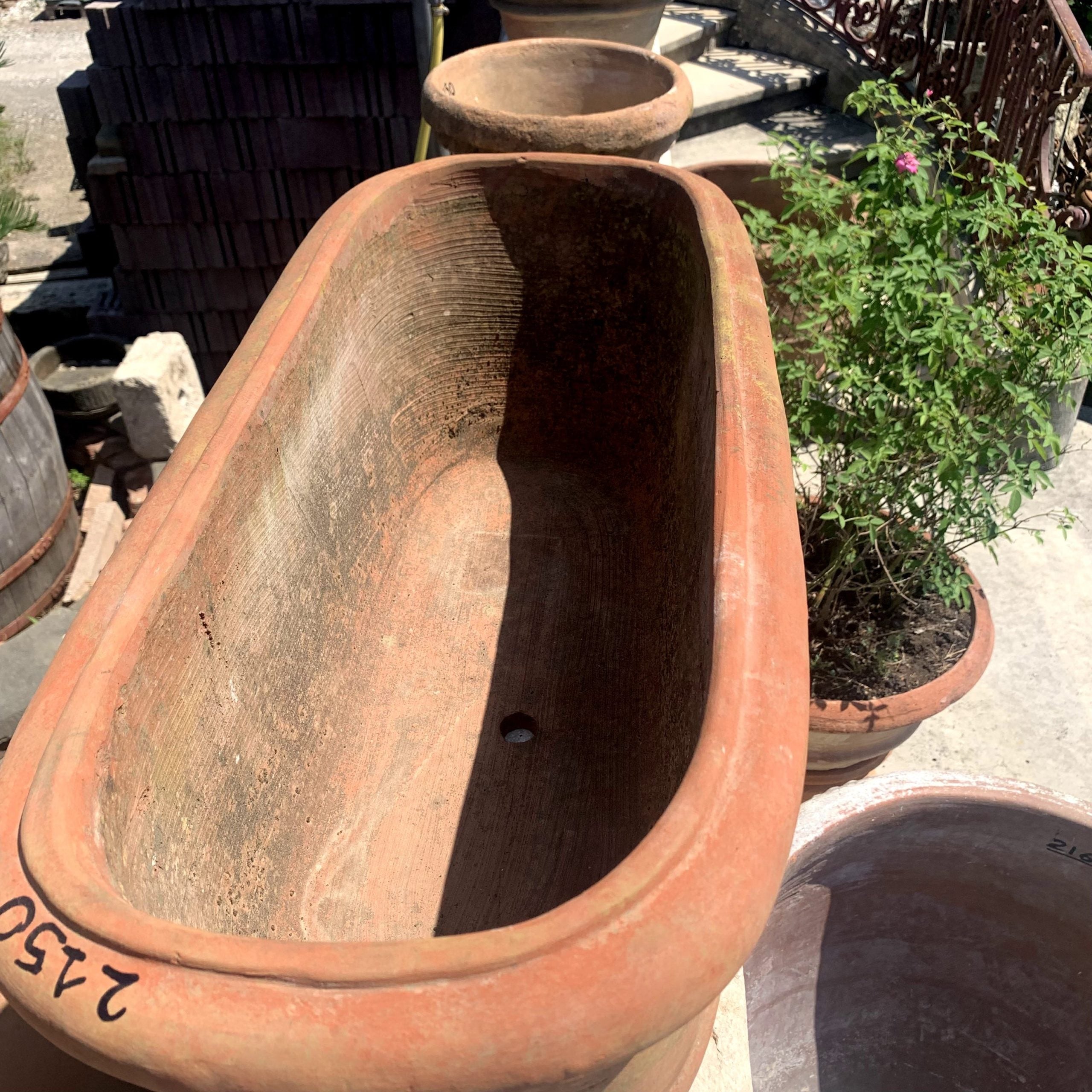 Terracotta vase with mask