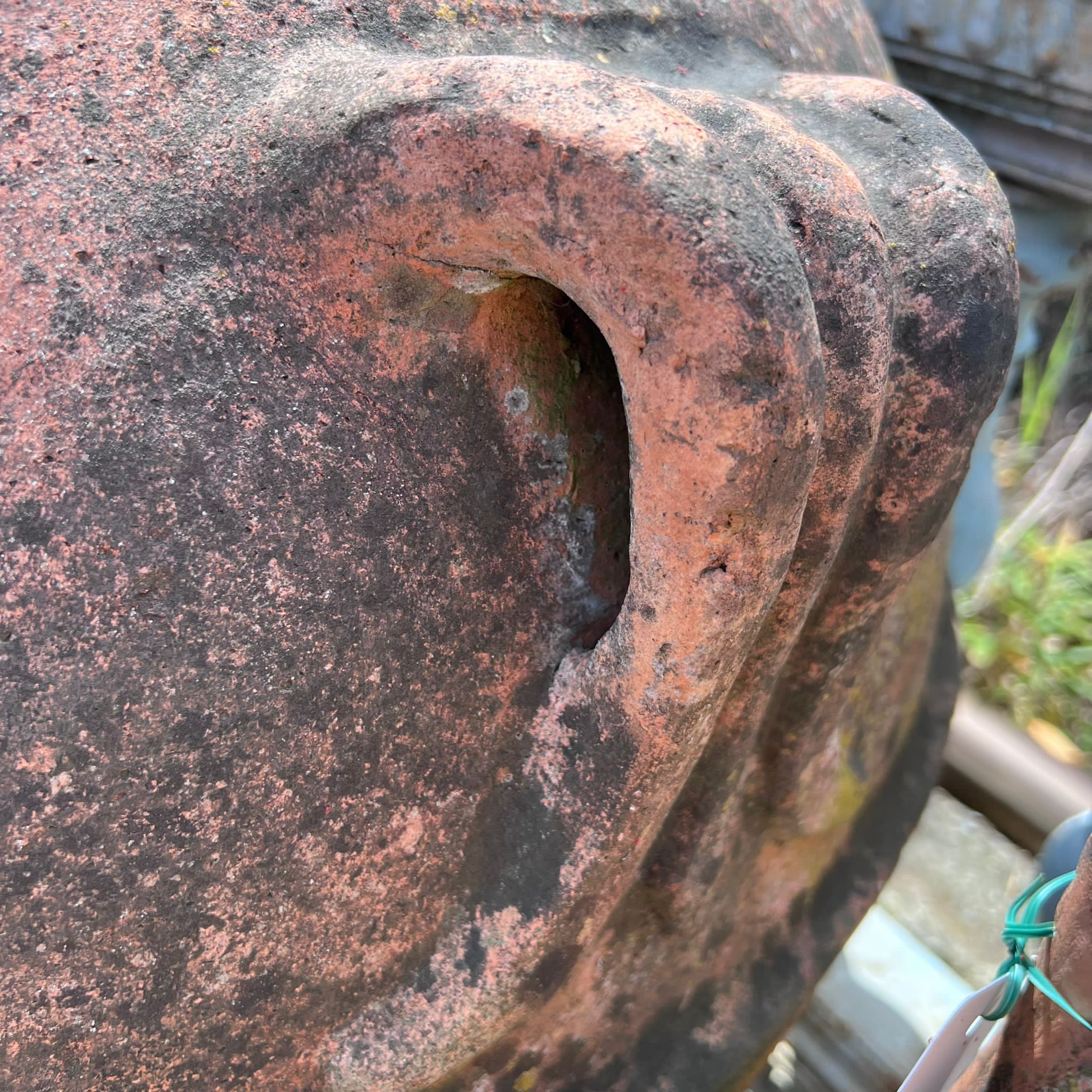 Terracotta jar with mask