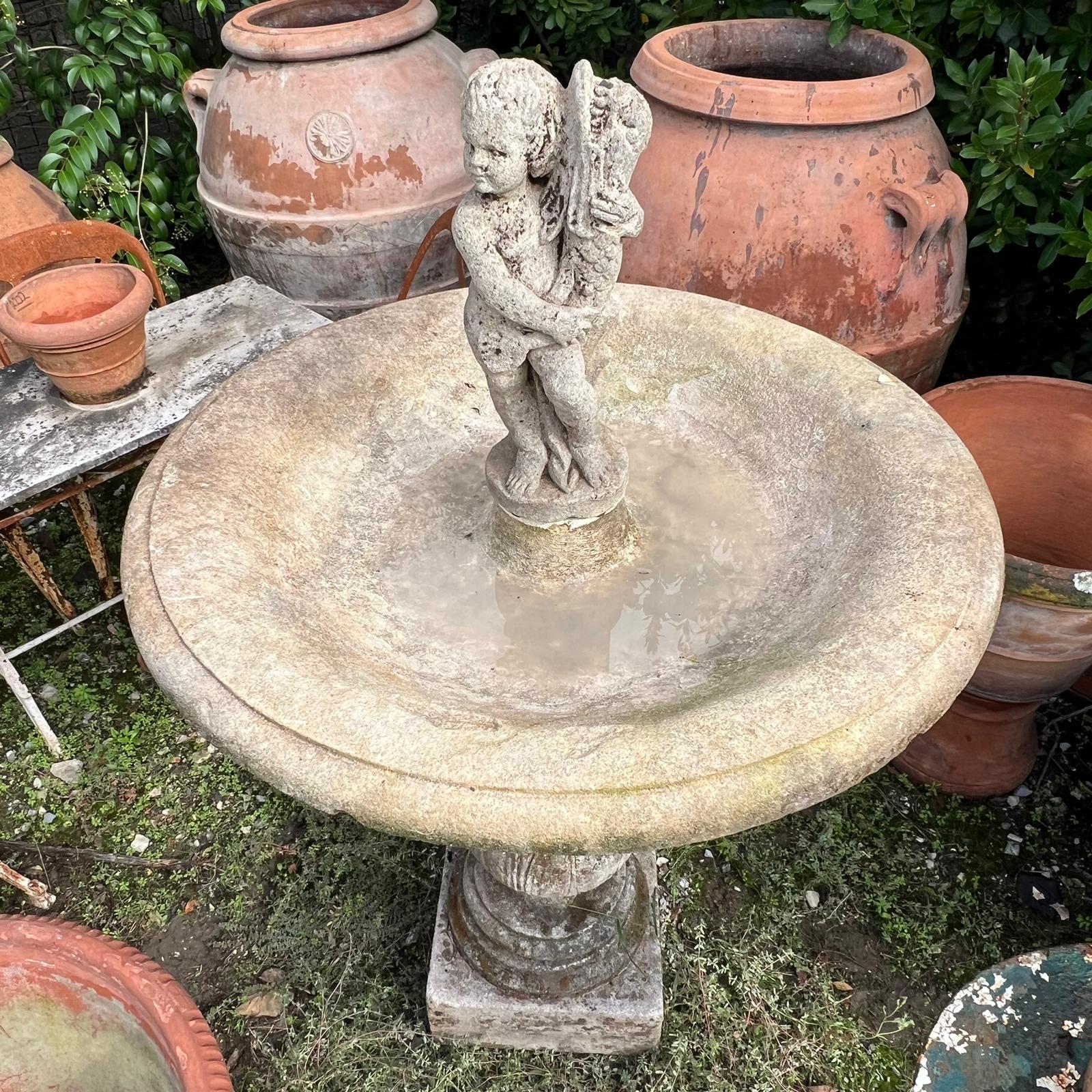 Central fountain with cherub