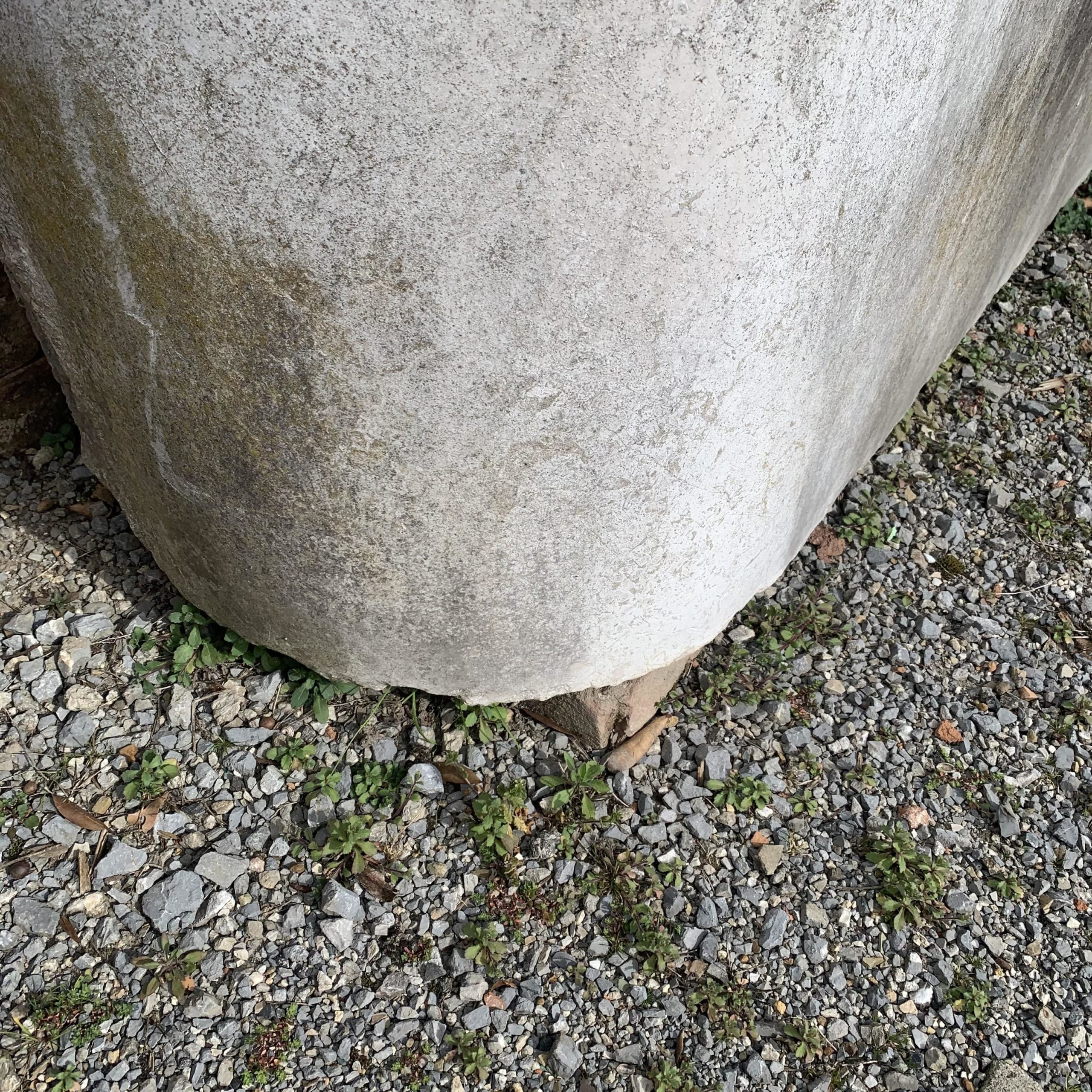 White stone wall-mounted bathtub