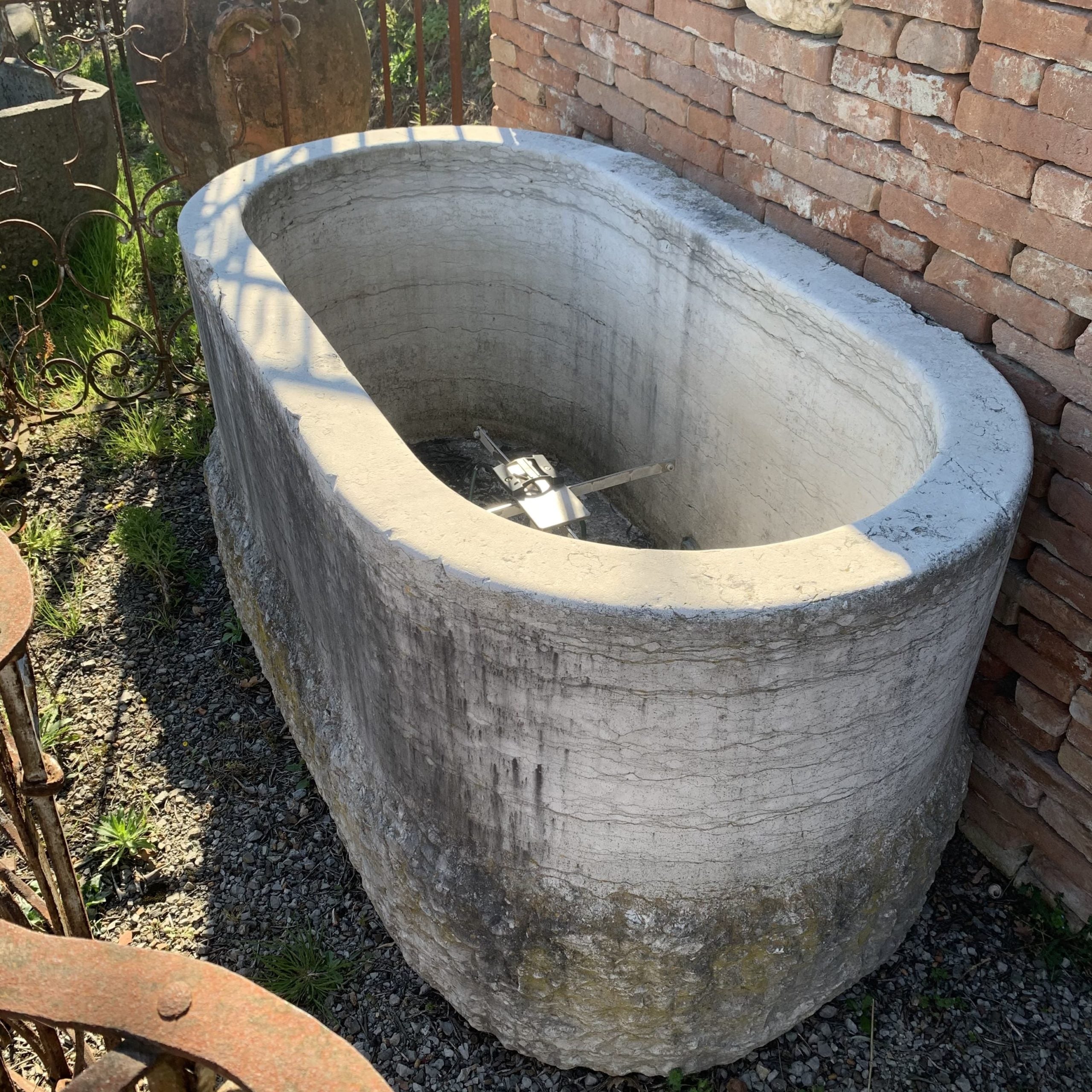 Oval white stone tub