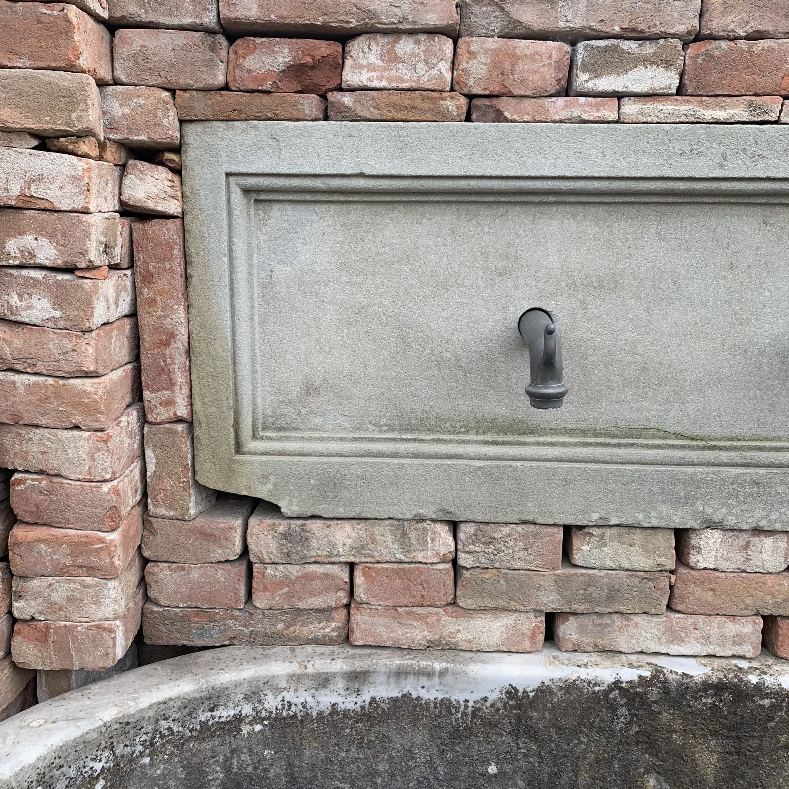 White marble wall fountain