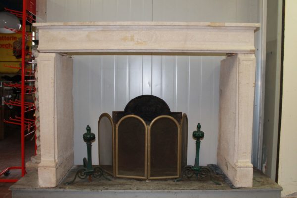 Antique light limestone fireplace