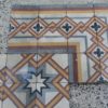 Pavimento in pastina con disegno geometrico